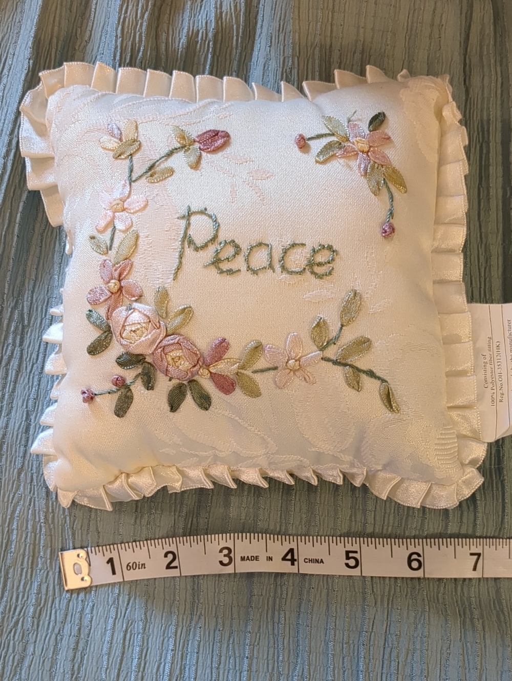 Embroidered 'Peace' Decorative Throw Pillow in Ivory with Pastel Floral Accents